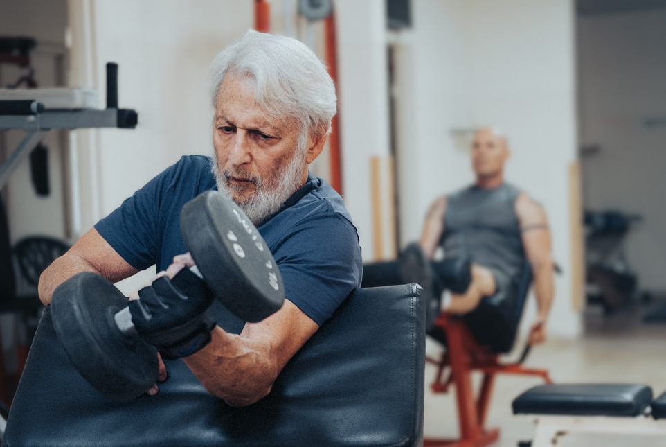Elderly man exercising in a gym