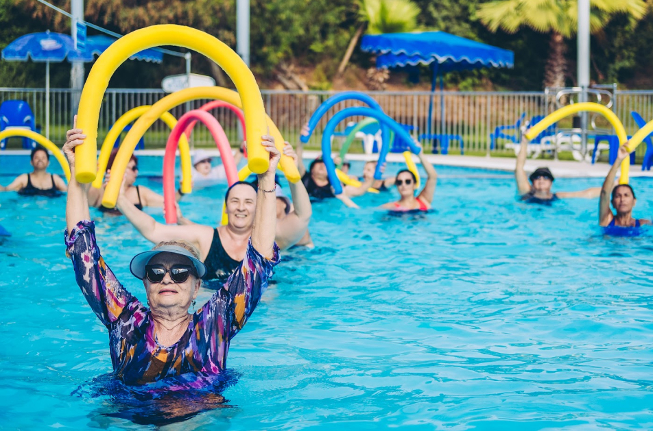 Group of elderly women exercising in a pool